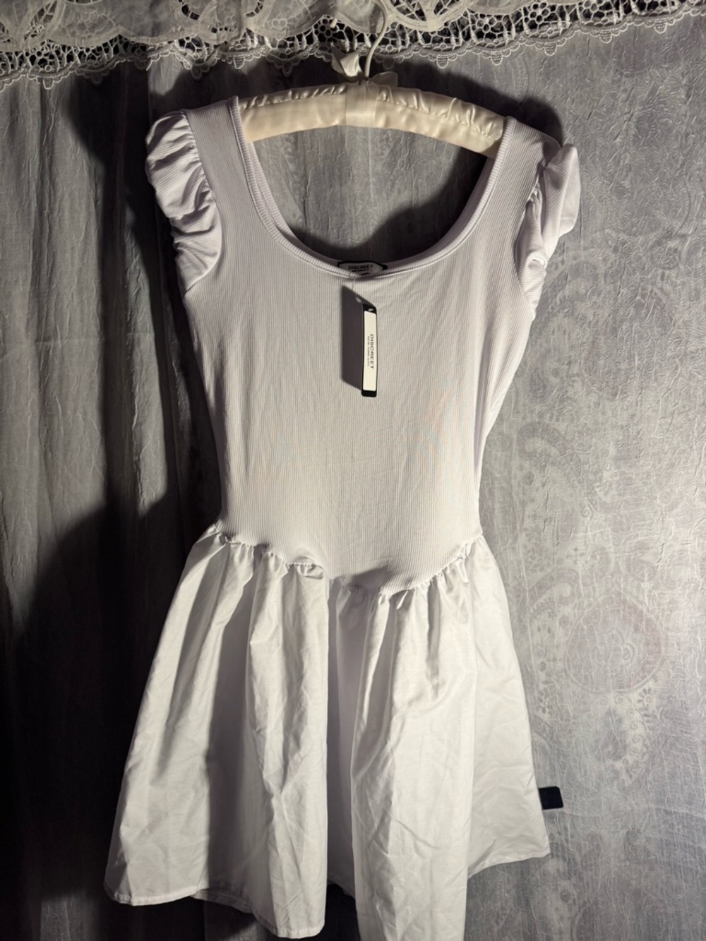 Discreet New York City flare white dress